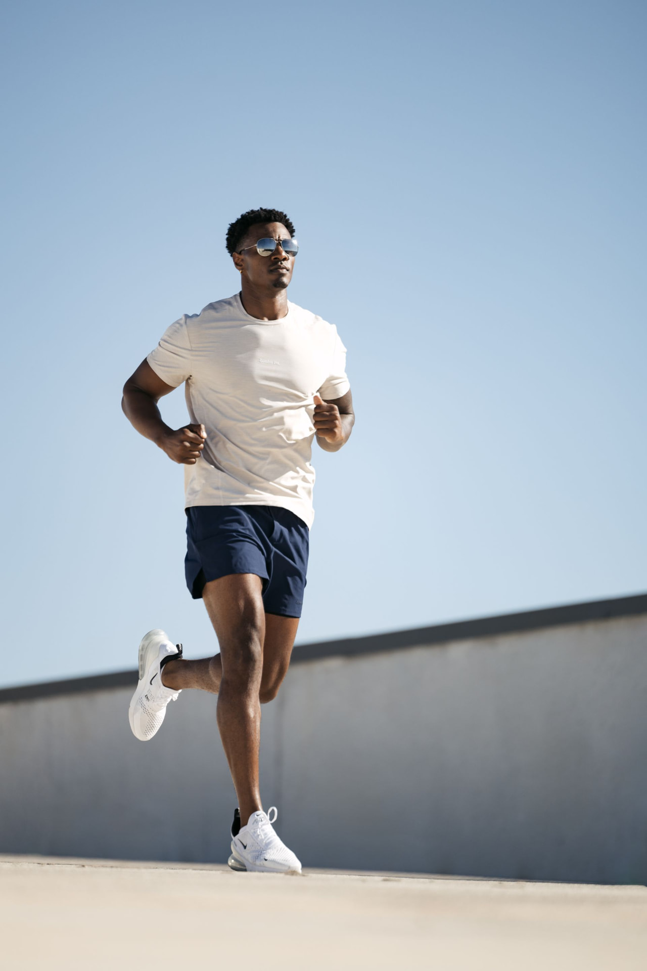 Athlete running outdoors during a performance training session